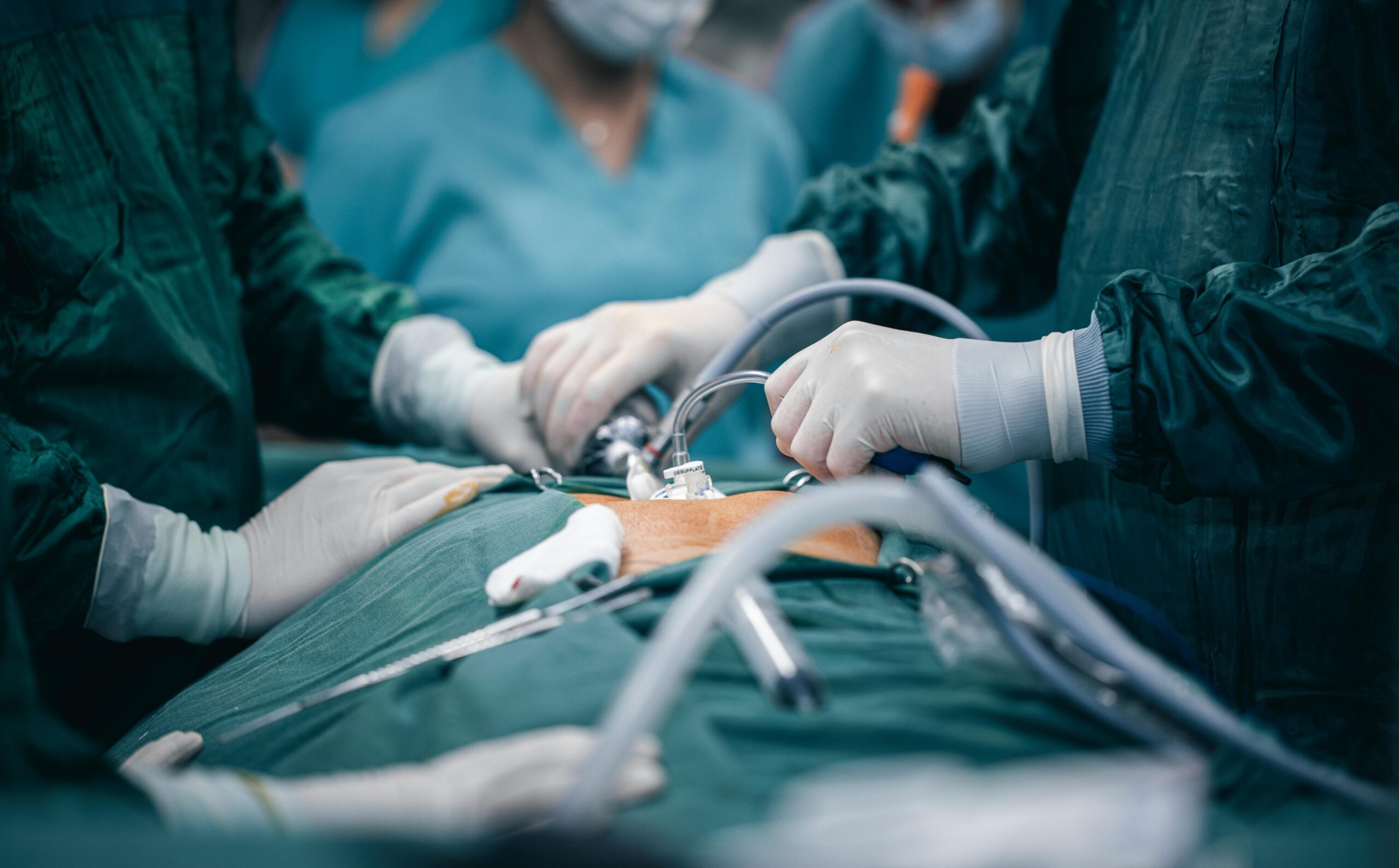 A detailed view of surgeons in action during an operation, highlighting surgical precision.